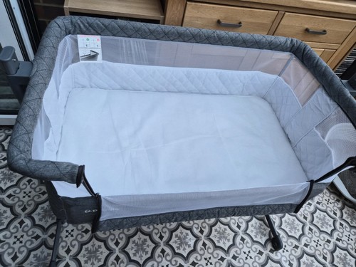 Puggle baby bassinet next to - baby,